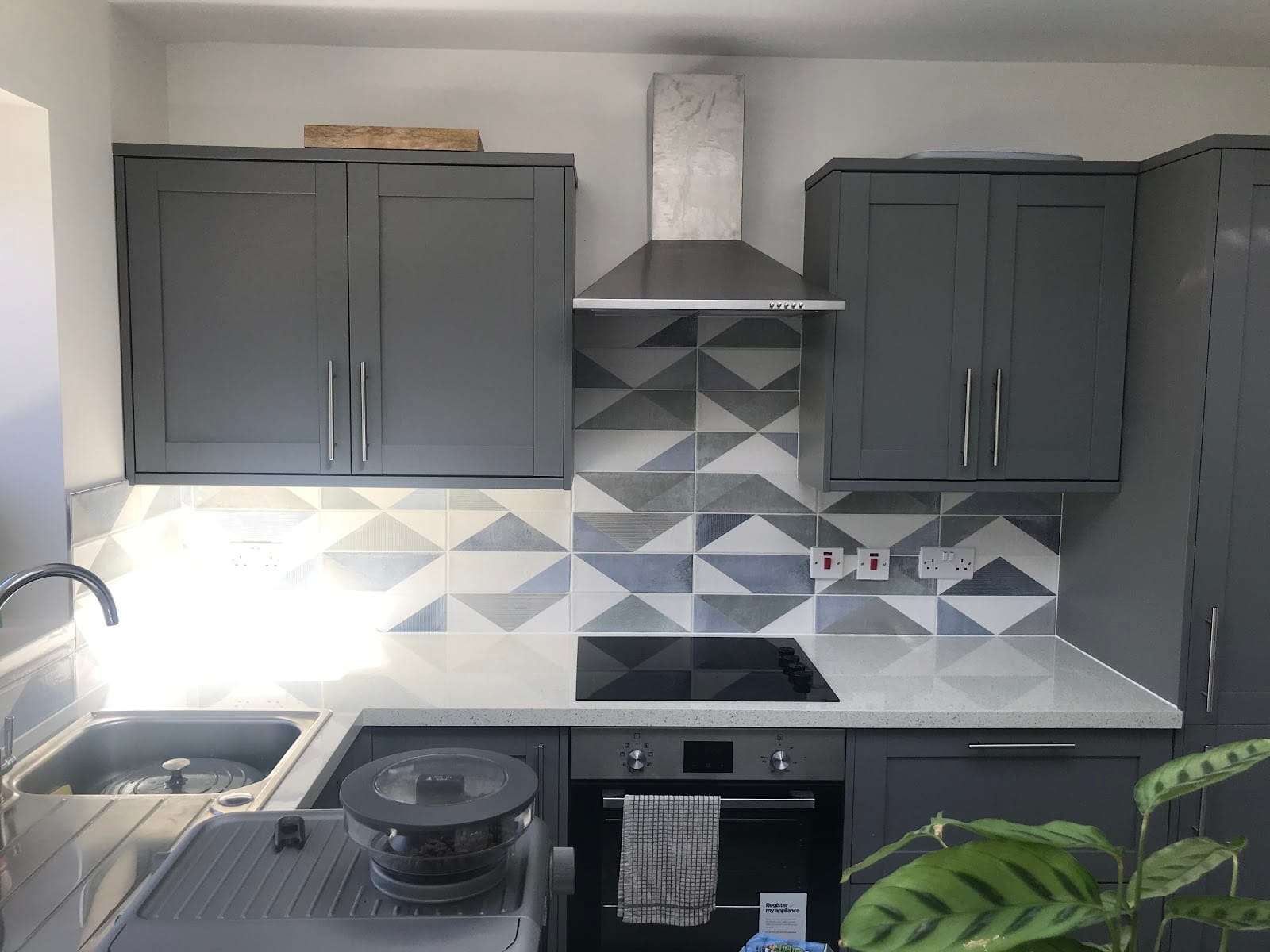 Geometric tile kitchen splashback, by Roman Tiling Services