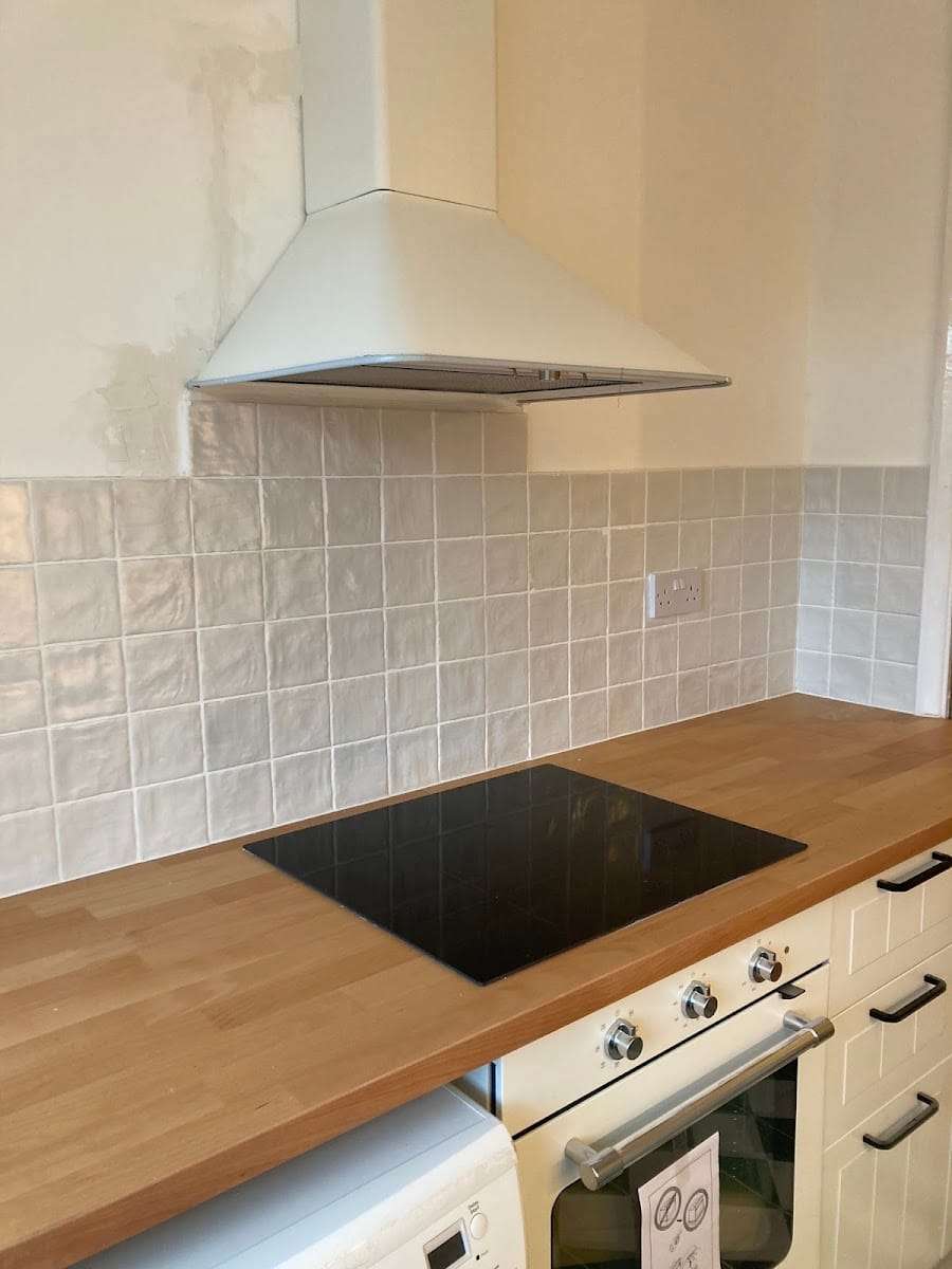 Handmade white tile splashback, by Roman Tiling Services